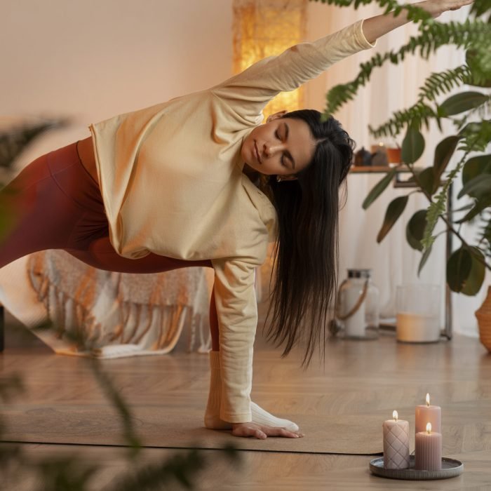 woman-doing-yoga-indoors-full-shot